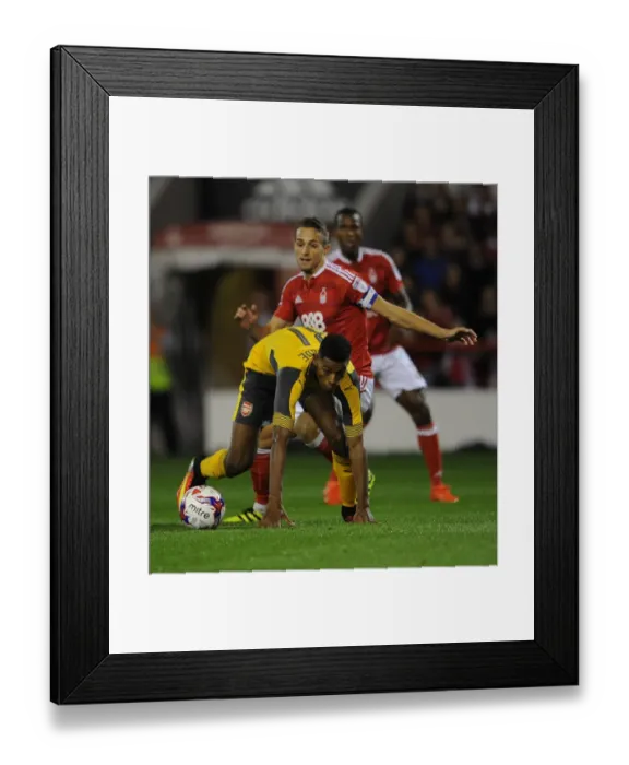 Framed Print : Jeff Reine-Adelaide (Arsenal) Chris Cohen (Forest). Nottingham Forest 0: 4 Arsenal Framed Print : Jeff Reine-Adelaide (Arsenal) Chris Cohen (Forest). Nottingham Forest 0: 4 Arsenal