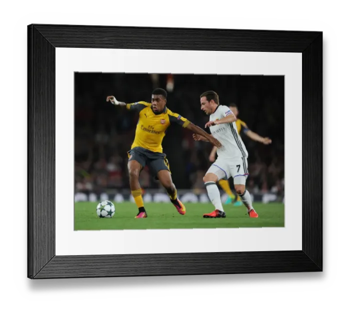 Framed Print : Arsenal's Alex Iwobi Goes Head-to-Head with FC Basel's Luca Lang in 2016-17 UEFA Champions League Showdown Framed Print : Arsenal's Alex Iwobi Goes Head-to-Head with FC Basel's Luca Lang in 2016-17 UEFA Champions League Showdown