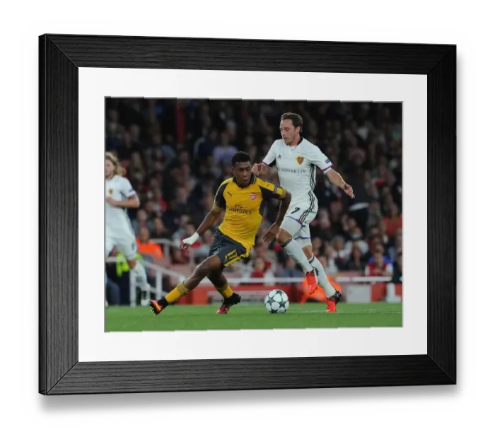 Framed Print : Clash of the Midfield: Alex Iwobi vs. Luca Zuffi in Arsenal's UEFA Champions League Battle