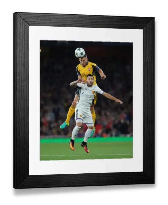 Framed Print : Koscielny's Defiant Header: Arsenal vs. Basel in Champions League Showdown Framed Print : Koscielny's Defiant Header: Arsenal vs. Basel in Champions League Showdown