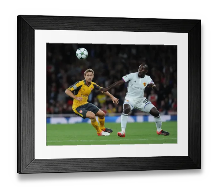 Framed Print : Monreal vs. Doumbia: A Battle in the Arsenal vs. FC Basel Champions League Clash Framed Print : Monreal vs. Doumbia: A Battle in the Arsenal vs. FC Basel Champions League Clash
