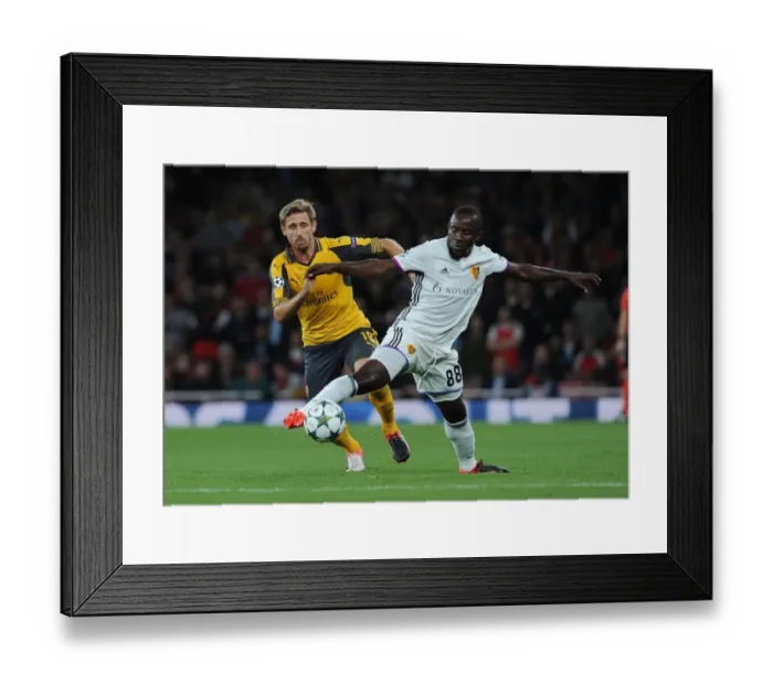 Framed Print : Monreal vs. Doumbia: A Champions League Showdown at Emirates Stadium Framed Print : Monreal vs. Doumbia: A Champions League Showdown at Emirates Stadium