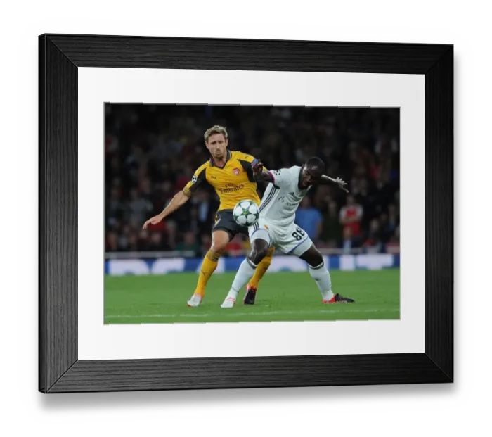 Framed Print : Monreal vs. Doumbia: A Champions League Showdown at Arsenal's Emirates Stadium Framed Print : Monreal vs. Doumbia: A Champions League Showdown at Arsenal's Emirates Stadium