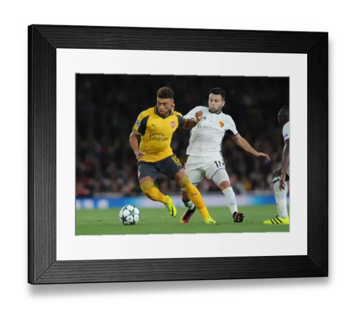 Framed Print : Oxlade-Chamberlain vs. Steffen: A Battle in the Arsenal vs. Basel UEFA Champions League Clash