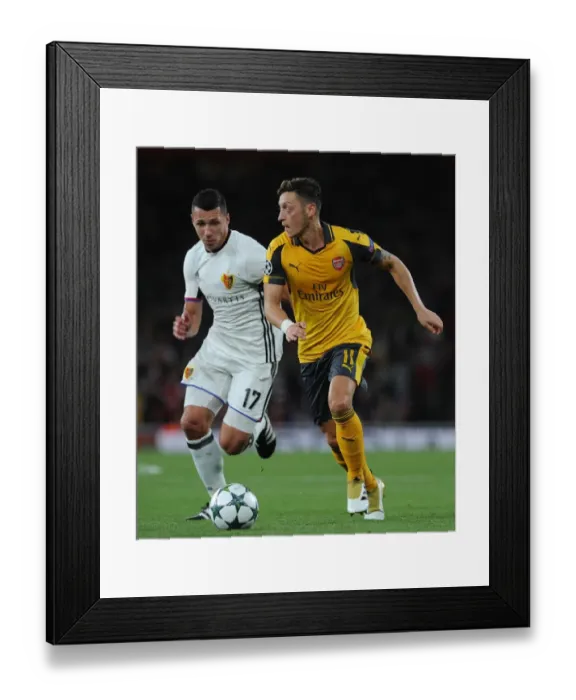 Framed Print : Mesut Ozil vs Marek Suchy: A Football Battle at Arsenal's Emirates Stadium - Arsenal FC vs FC Basel 2016-17