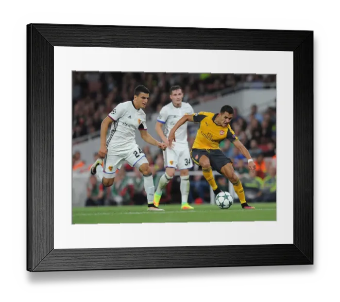 Framed Print : Clash of Stars: Sanchez vs. Elyounoussi in the Champions League