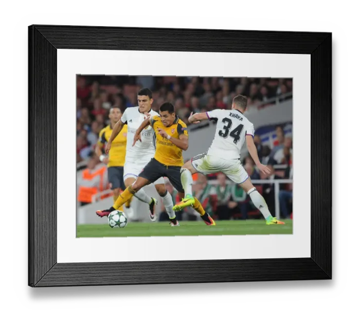 Framed Print : Showdown at Emirates: Alexis Sanchez vs. Mohamed Elyounoussi in Arsenal's Champions League Battle