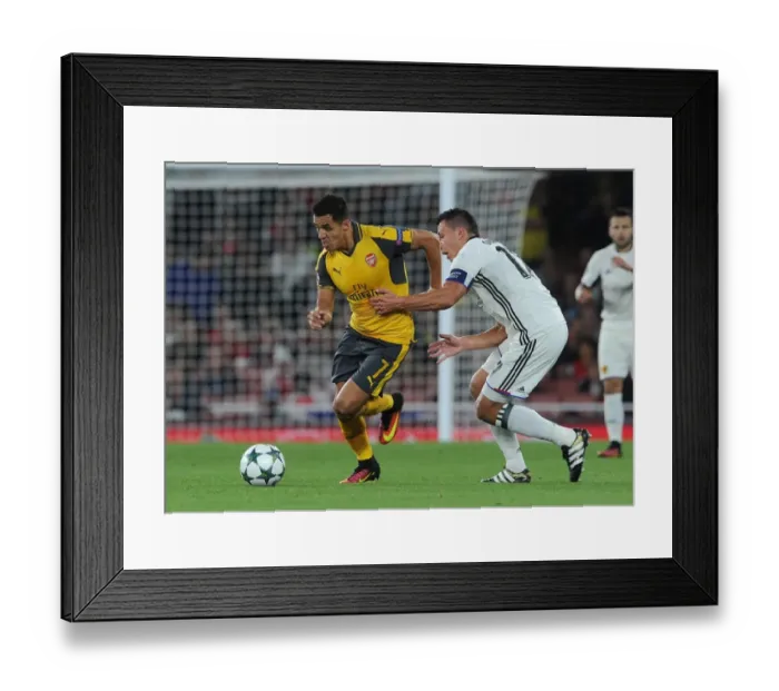 Framed Print : Sanchez vs. Suchy: Intense Face-Off Between Arsenal's Sanchez and Basel's Defender in Champions League Match Framed Print : Sanchez vs. Suchy: Intense Face-Off Between Arsenal's Sanchez and Basel's Defender in Champions League Match