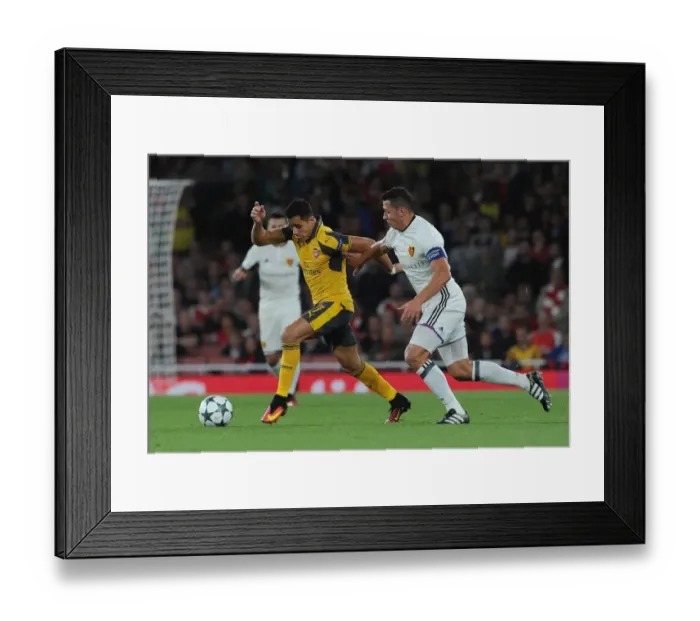 Framed Print : Sanchez vs. Suchy: A Champions League Showdown - Intense Face-Off Between Arsenal's Sanchez and Basel's Defender Framed Print : Sanchez vs. Suchy: A Champions League Showdown - Intense Face-Off Between Arsenal's Sanchez and Basel's Defender