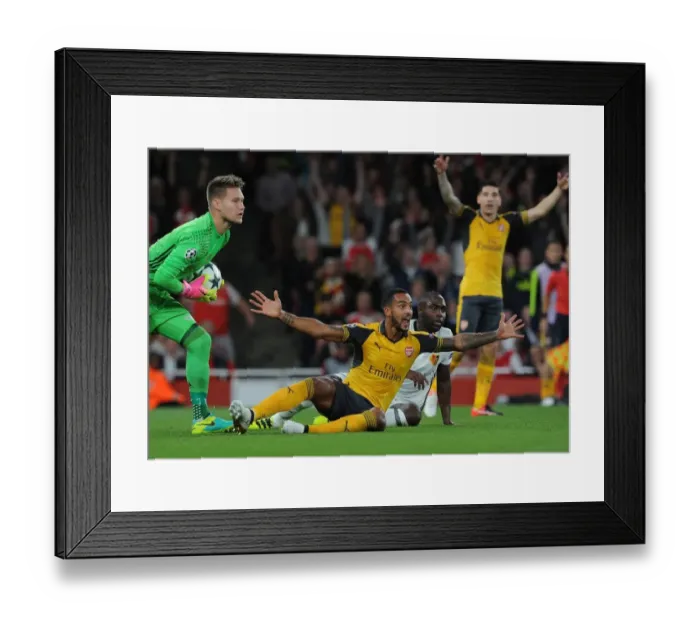 Framed Print : Theo Walcott's Penalty Plea: Arsenal's Battle for a Decisive Spot Kick vs. FC Basel Framed Print : Theo Walcott's Penalty Plea: Arsenal's Battle for a Decisive Spot Kick vs. FC Basel