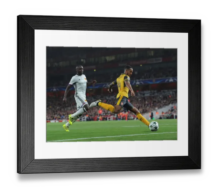 Framed Print : Theo Walcott vs. Eder Balanta: A Clash in the Arsenal FC vs. FC Basel UEFA Champions League Match Framed Print : Theo Walcott vs. Eder Balanta: A Clash in the Arsenal FC vs. FC Basel UEFA Champions League Match