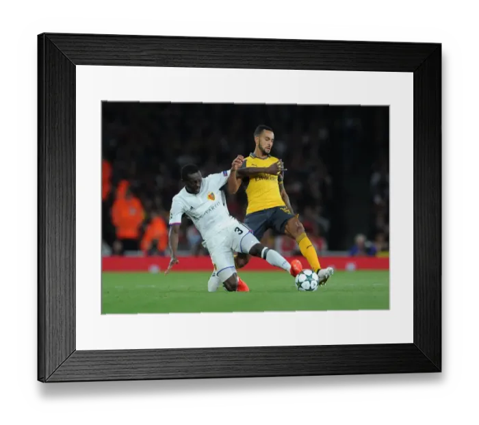 Framed Print : Theo Walcott vs Adama Traore: A Clash of Wings at the Emirates