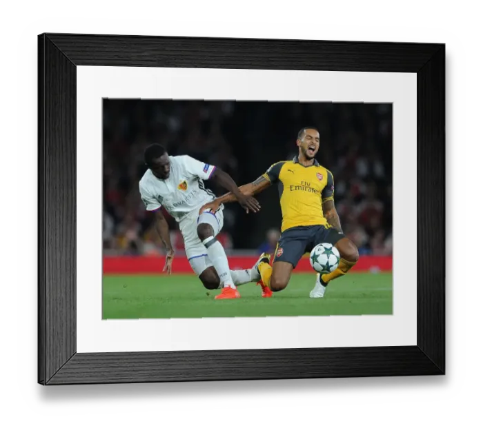 Framed Print : Clash of Wings: Theo Walcott vs. Adama Traore in Arsenal's UEFA Champions League Showdown against FC Basel Framed Print : Clash of Wings: Theo Walcott vs. Adama Traore in Arsenal's UEFA Champions League Showdown against FC Basel