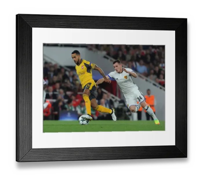 Framed Print : Theo Walcott vs. Taulant Xhaka: A Battle at the Emirates - Arsenal FC vs. FC Basel UEFA Champions League Match, 2016-17 Framed Print : Theo Walcott vs. Taulant Xhaka: A Battle at the Emirates - Arsenal FC vs. FC Basel UEFA Champions League Match, 2016-17