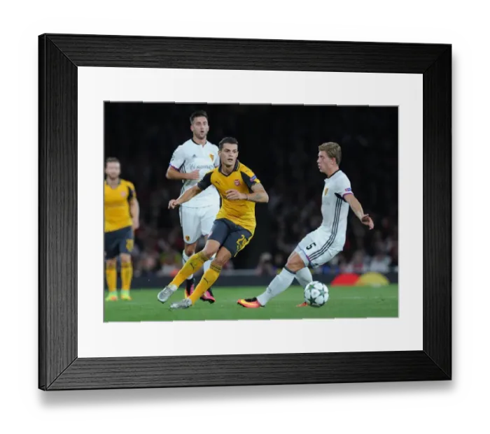 Framed Print : Xhaka vs. Fransson: A Battle for Ball Possession in Arsenal's UEFA Champions League Clash against FC Basel Framed Print : Xhaka vs. Fransson: A Battle for Ball Possession in Arsenal's UEFA Champions League Clash against FC Basel