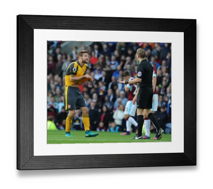 Framed Print : Mustafi's Contentious Encounter with Referee Craig Pawson during Burnley vs Arsenal (2016-17) Framed Print : Mustafi's Contentious Encounter with Referee Craig Pawson during Burnley vs Arsenal (2016-17)