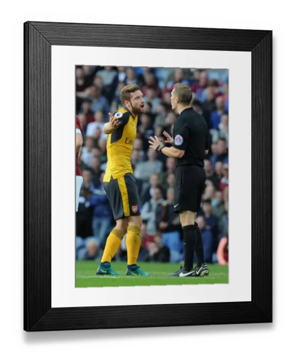 Framed Print : Mustafi's Contentious Clash with Referee Craig Pawson during Burnley vs Arsenal (2016-17)