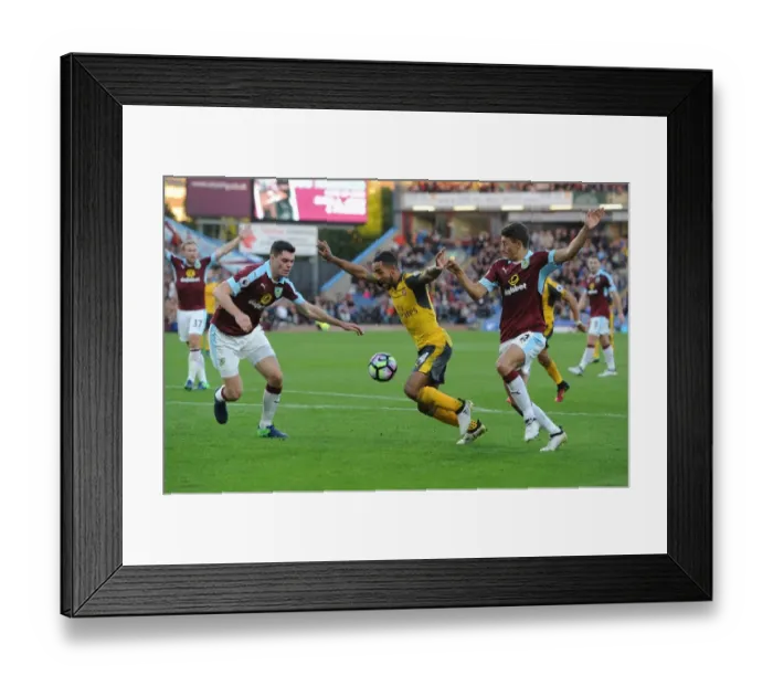 Framed Print : Theo Walcott Faces Off Against Burnley Defenders: A Intense Battle at Turf Moor, Premier League 2016-17
