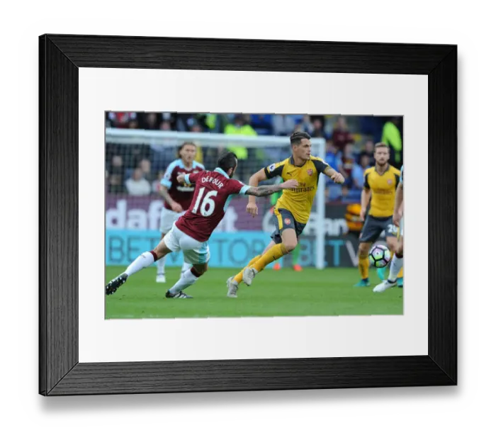 Framed Print : Xhaka Powers Past Defour: Burnley vs. Arsenal, Premier League 2016-17 Framed Print : Xhaka Powers Past Defour: Burnley vs. Arsenal, Premier League 2016-17