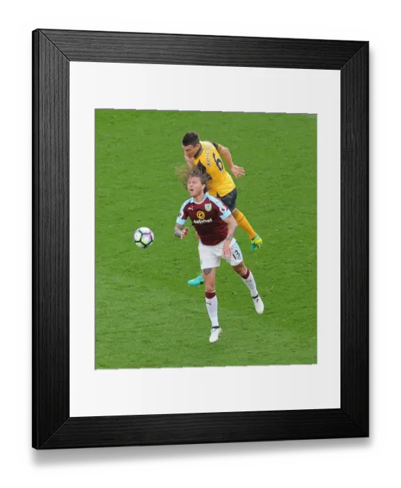 Framed Print : Clash of the Titans: Koscielny vs Hendrick - A Premier League Battle Framed Print : Clash of the Titans: Koscielny vs Hendrick - A Premier League Battle