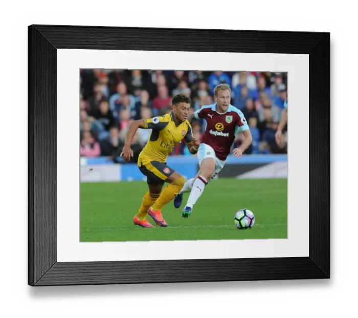 Framed Print : Oxlade-Chamberlain vs. Arfield: A Premier League Battle at Turf Moor Framed Print : Oxlade-Chamberlain vs. Arfield: A Premier League Battle at Turf Moor