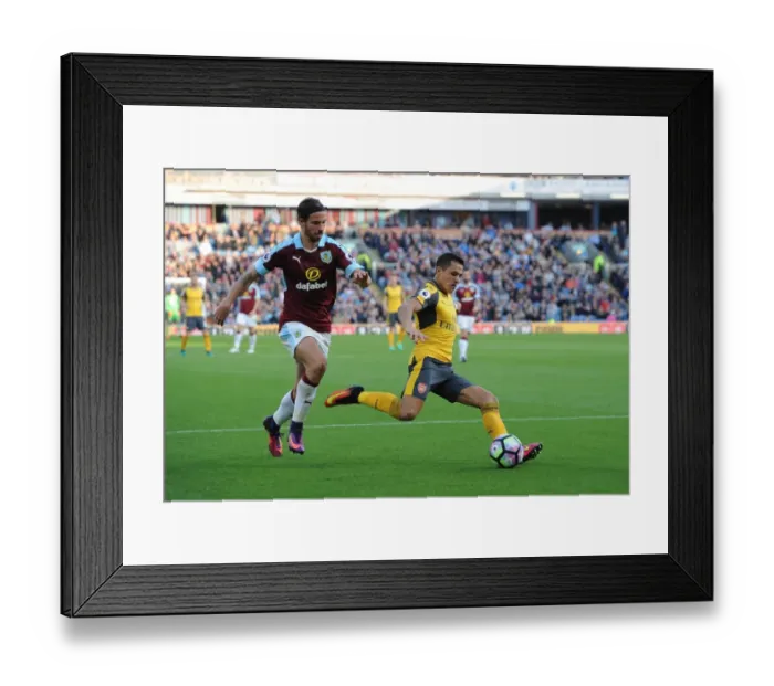 Framed Print : Alexis Sanchez (Arsenal) George Boyd (Burnley). Burnley 0: 1 Arsenal. Premier League Framed Print : Alexis Sanchez (Arsenal) George Boyd (Burnley). Burnley 0: 1 Arsenal. Premier League