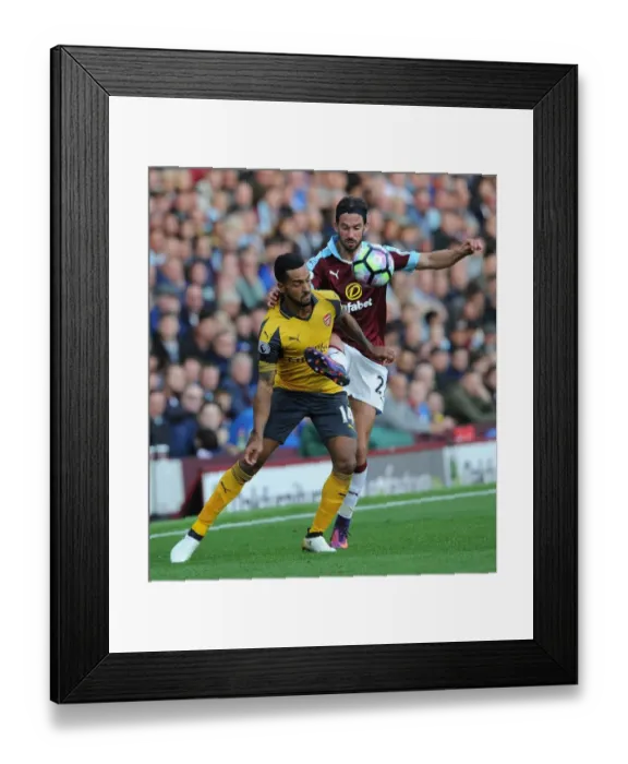 Framed Print : Theo Walcott vs George Boyd: A Premier League Showdown at Burnley's Turf Moor (2016-17) Framed Print : Theo Walcott vs George Boyd: A Premier League Showdown at Burnley's Turf Moor (2016-17)