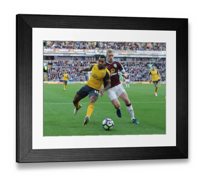 Framed Print : Theo Walcott vs Ben Mee: A Premier League Showdown at Burnley's Turf Moor (2016-17)