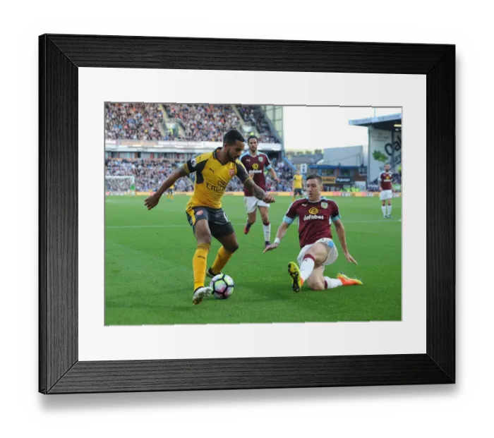 Framed Print : Theo Walcott vs Stephen Ward: A Premier League Showdown at Turf Moor
