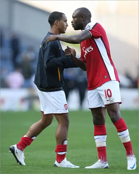 Arsenal captain William Gallas with Theo Walcott after the match