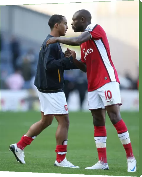 Arsenal captain William Gallas with Theo Walcott after the match
