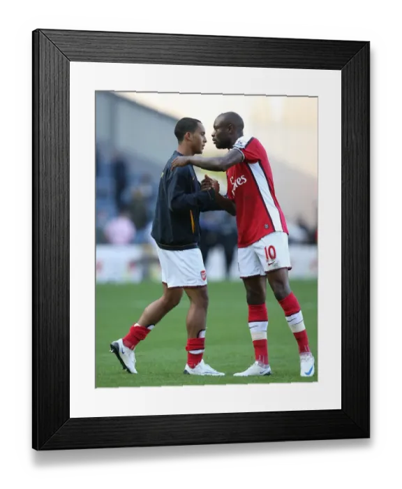 Framed Print : Arsenal captain William Gallas with Theo Walcott after the match
