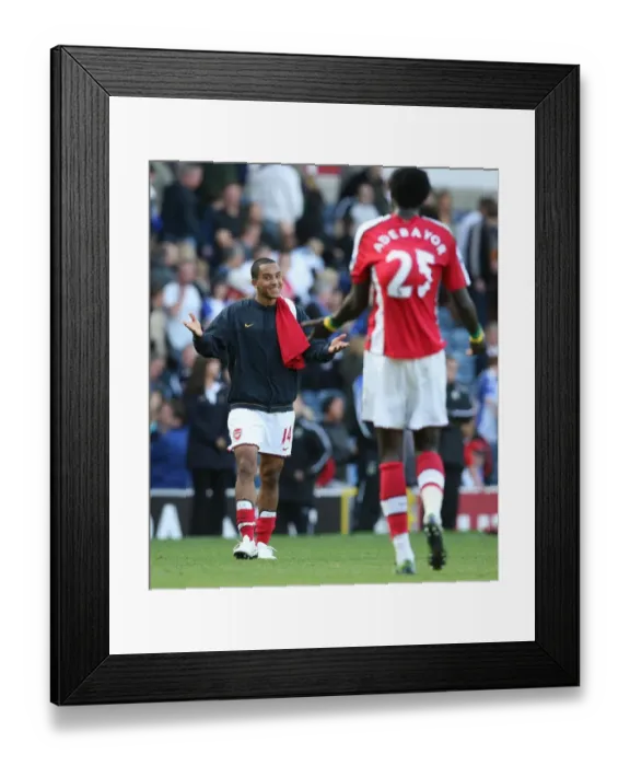Framed Print : Celebrating Victory: Theo Walcott and Emmanuel Adebayor, Arsenal's Unstoppable Duo