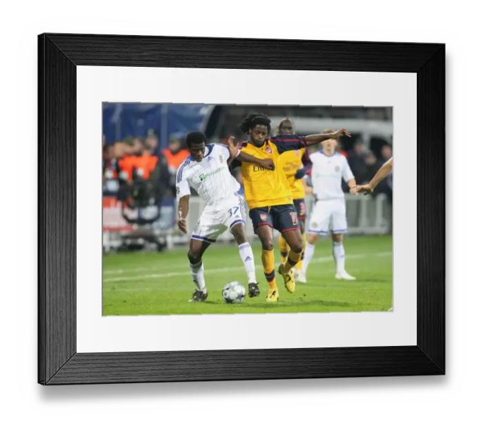 Framed Print : Clash of the Midfielders: Song vs. Yussuf in UEFA Champions League Battle Framed Print : Clash of the Midfielders: Song vs. Yussuf in UEFA Champions League Battle