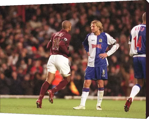Thierry Henry runs past Robbie Savage (Blackburn) after scoring Arsenals 2nd goal