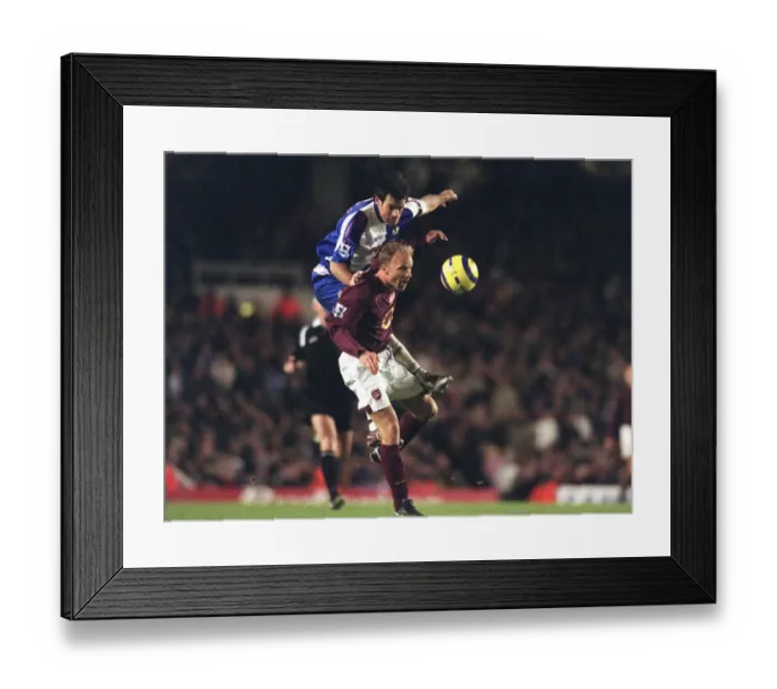 Framed Print : Dennis Bergkamp (Arsenal) Ryan Nelsen (Blackburn). Arsenal 3: 0 Blackburn Rovers Framed Print : Dennis Bergkamp (Arsenal) Ryan Nelsen (Blackburn). Arsenal 3: 0 Blackburn Rovers
