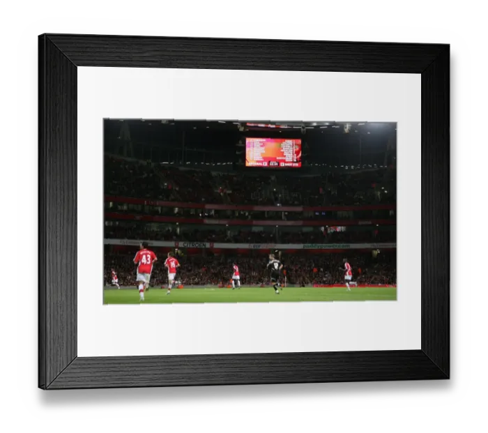 Framed Print : The scoreboard shows the Arsenal starting line up