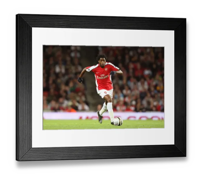 Framed Print : Alex Song's Dominance: Arsenal Crushes Sheffield United 6-0 in Carling Cup