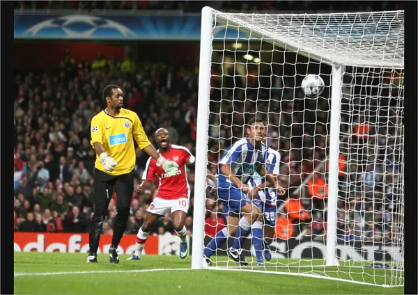 Porto goalkeeper Helton looks on as Emmanuel Adebayor s