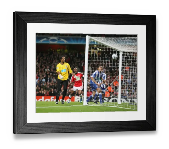 Framed Print : Porto goalkeeper Helton looks on as Emmanuel Adebayor s Framed Print : Porto goalkeeper Helton looks on as Emmanuel Adebayor s