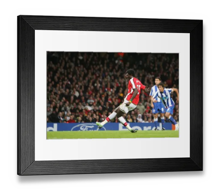 Framed Print : Emmanuel Adebayor shoots past Porto goalkeeper Helton