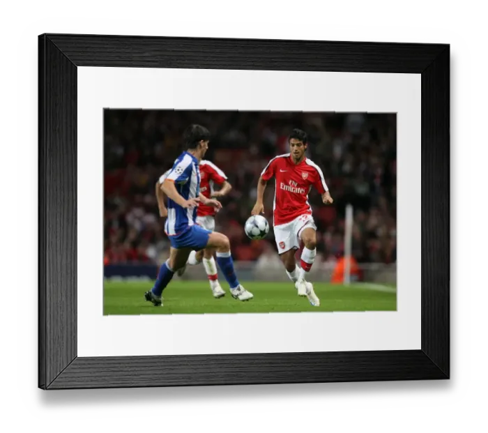 Framed Print : Carlos Vela (Arsenal) Cristian Sapunaru (Porto) Framed Print : Carlos Vela (Arsenal) Cristian Sapunaru (Porto)