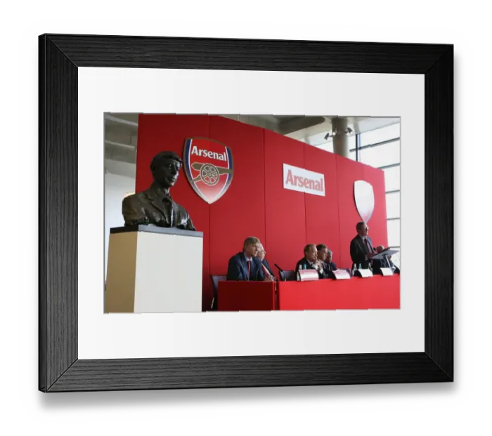 Framed Print : Arsene Wenger the Arsenal Manager seats next to his bust Framed Print : Arsene Wenger the Arsenal Manager seats next to his bust