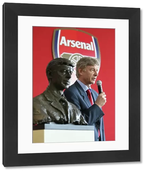 Arsene Wenger the Arsenal Manager with his bust