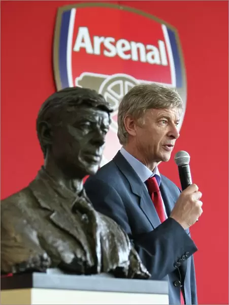 Arsene Wenger the Arsenal Manager with his bust