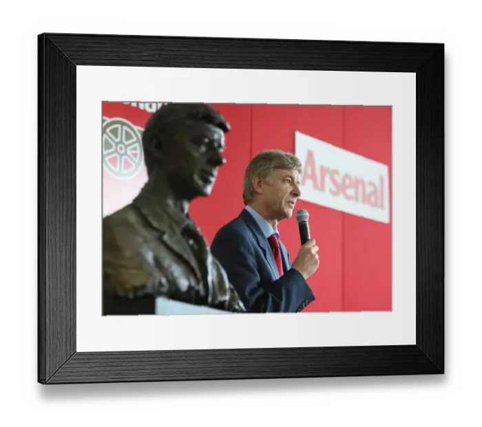 Framed Print : Arsene Wenger the Arsenal Manager standing next to his bust Framed Print : Arsene Wenger the Arsenal Manager standing next to his bust