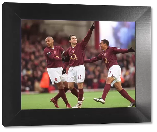 Cesc Fabregas celebrates scoring Arsenals 1st goal with Thierry Henry and Gilberto