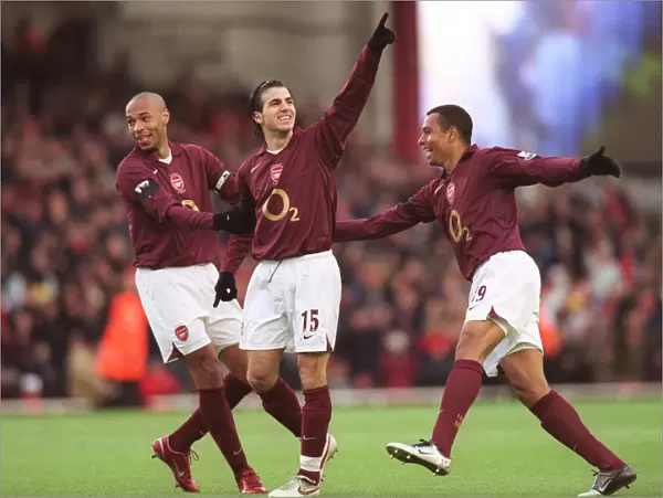 Cesc Fabregas celebrates scoring Arsenals 1st goal with Thierry Henry and Gilberto