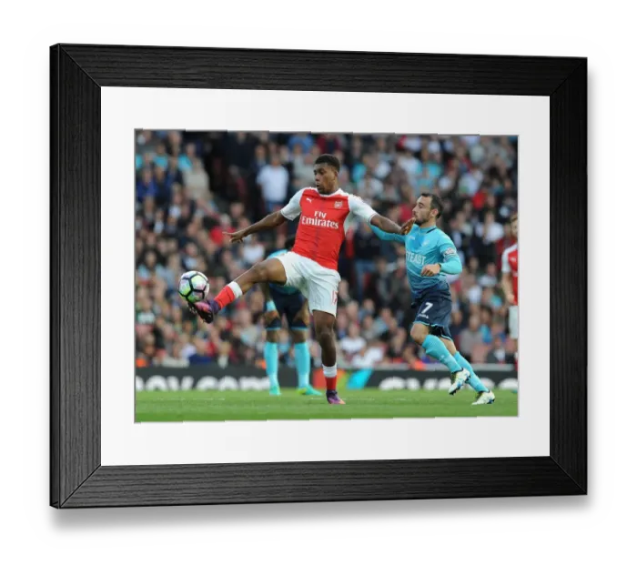 Framed Print : Arsenal's Iwobi Outsmarts Swansea's Britton in Premier League Showdown Framed Print : Arsenal's Iwobi Outsmarts Swansea's Britton in Premier League Showdown