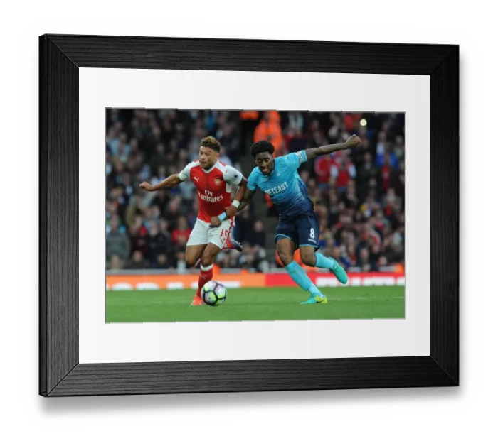 Framed Print : Oxlade-Chamberlain vs. Fer: A Premier League Battle at Emirates Stadium